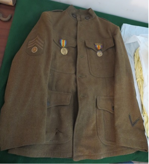Gervis Lemley’s service coat, with insignia on the right sleeve designating his position as a Motor Transport Sergeant. Image by Rick Kriebel, the Stone House Foundation.